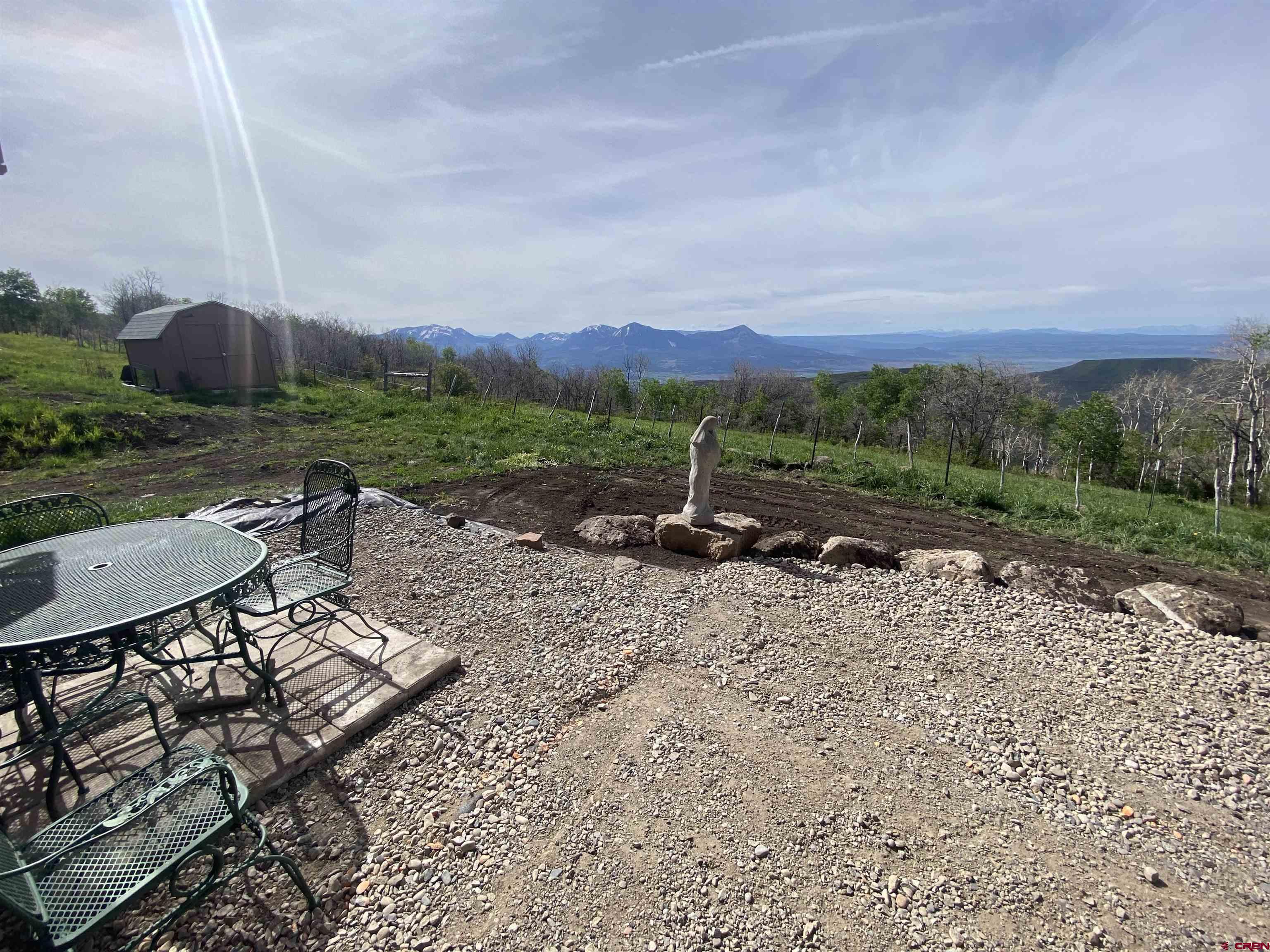 19514 Johnson Road Hotchkiss, CO 81419 - Photo 12 of 27 a view of a backyard with sitting area