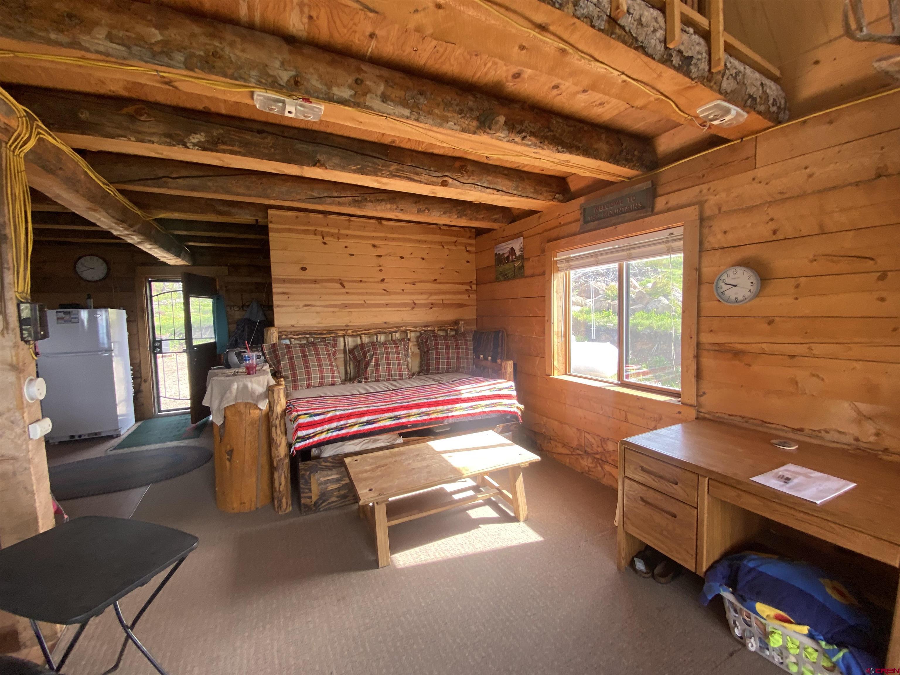 19514 Johnson Road Hotchkiss, CO 81419 - Photo 5 of 27 a bedroom with furniture and a window