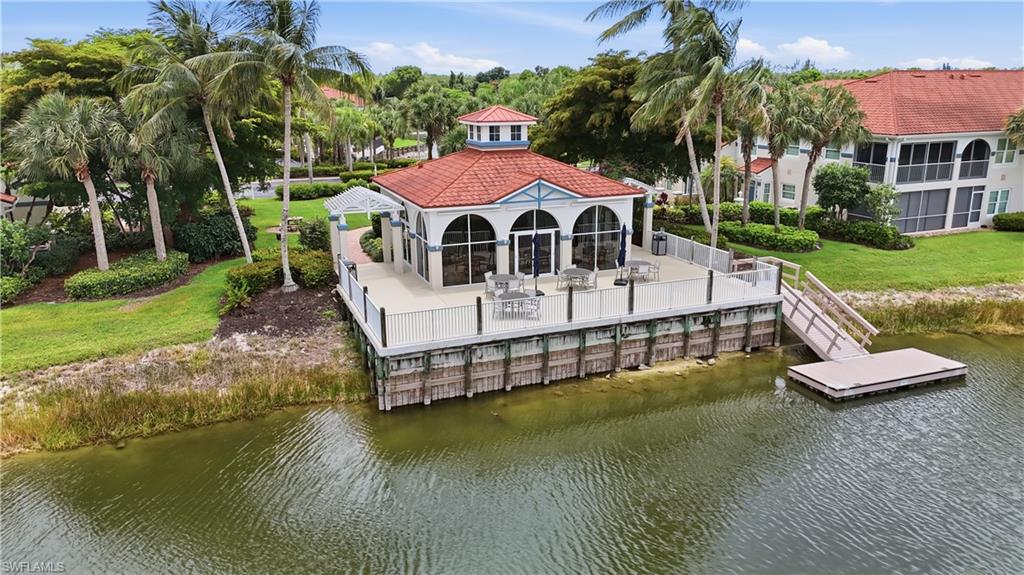 10871 Crooked River Road, Unit 202 Estero, FL 34135 - Photo 38 of 46 a view of a house with pool