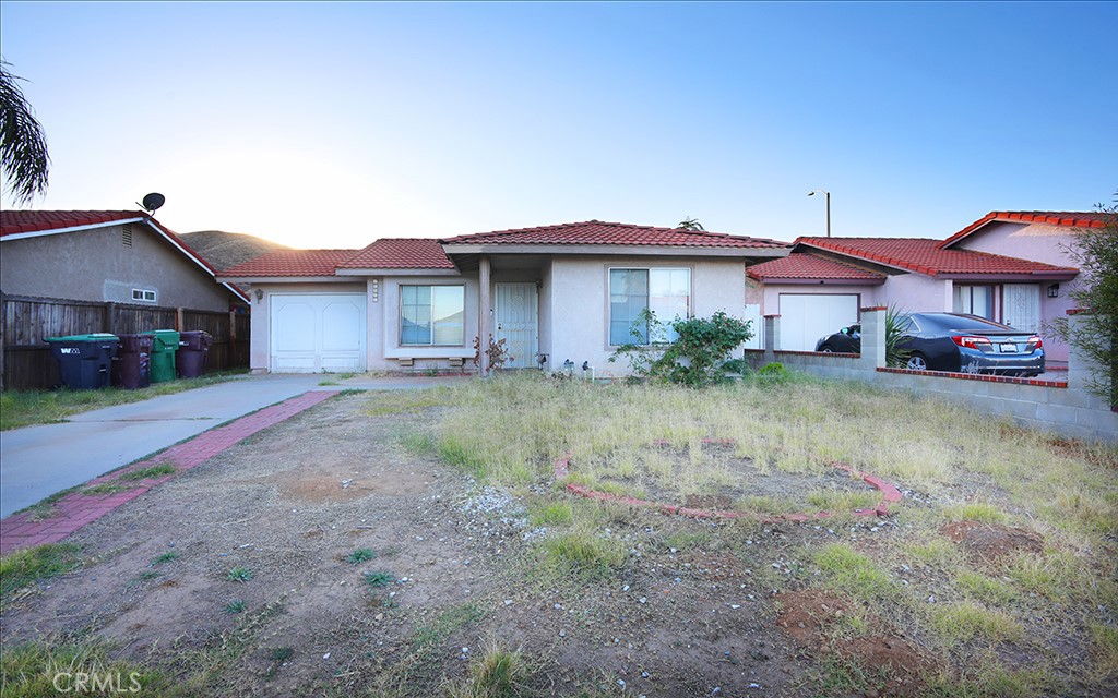27603 Genevieve Drive Menifee, CA 92586 - Photo 1 of 11 a front view of a house with a yard