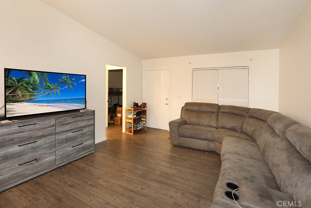 27603 Genevieve Drive Menifee, CA 92586 - Photo 2 of 11 a living room with furniture and a flat screen tv
