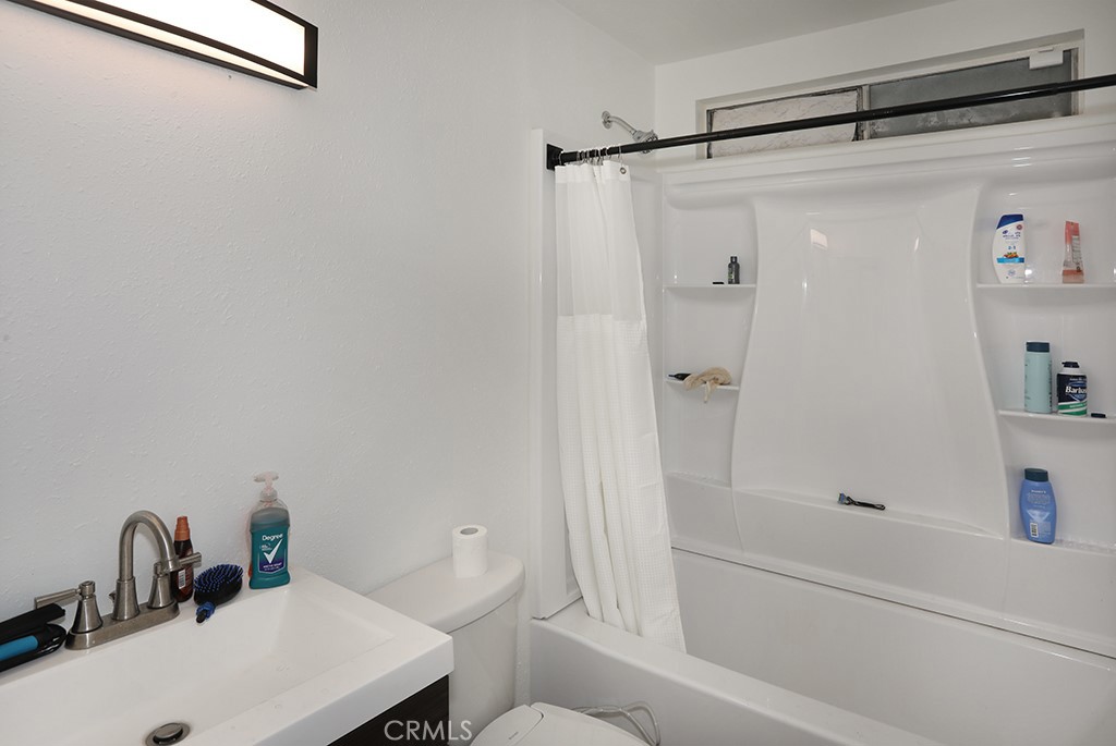 27603 Genevieve Drive Menifee, CA 92586 - Photo 5 of 11 a bathroom with a sink and a mirror