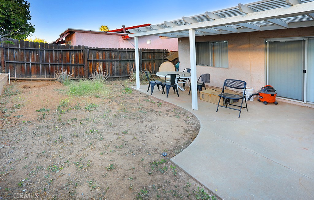 27603 Genevieve Drive Menifee, CA 92586 - Photo 9 of 11 a view of a backyard with a patio and garden