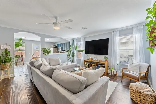 a kitchen with a refrigerator and a stove top oven