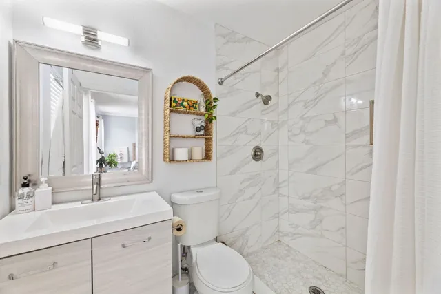 a bedroom with a bed and a bookshelf