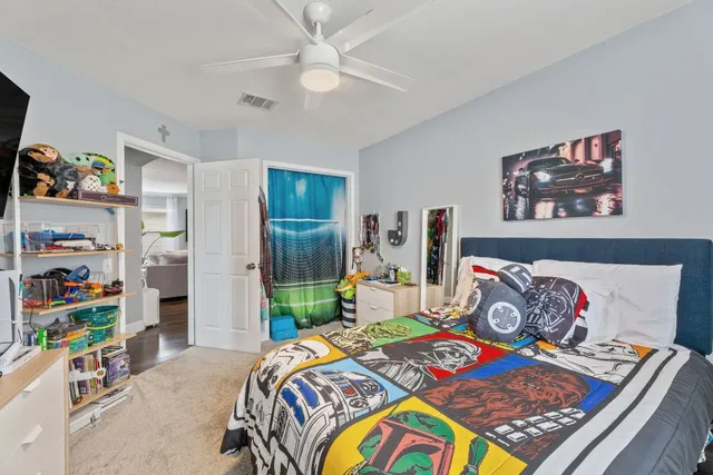 a bathroom with a toilet a sink and a mirror