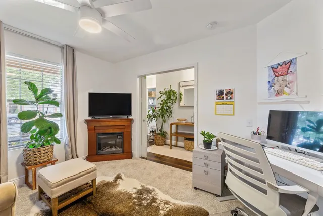 a view of a patio with table and chairs and potted plants with sky view