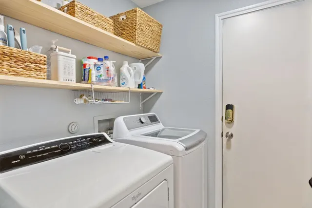 a living room with fireplace furniture and a flat screen tv