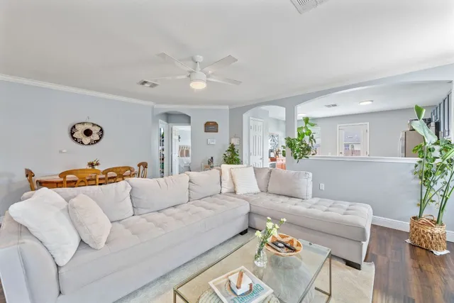 a living room with furniture and a table