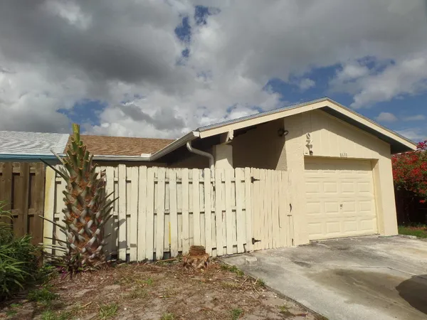a front view of a house with a garage