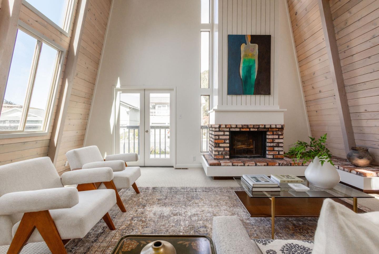 314 Roosevelt Boulevard Half Moon Bay, CA 94019 - Photo 11 of 58 a living room with furniture and a fireplace