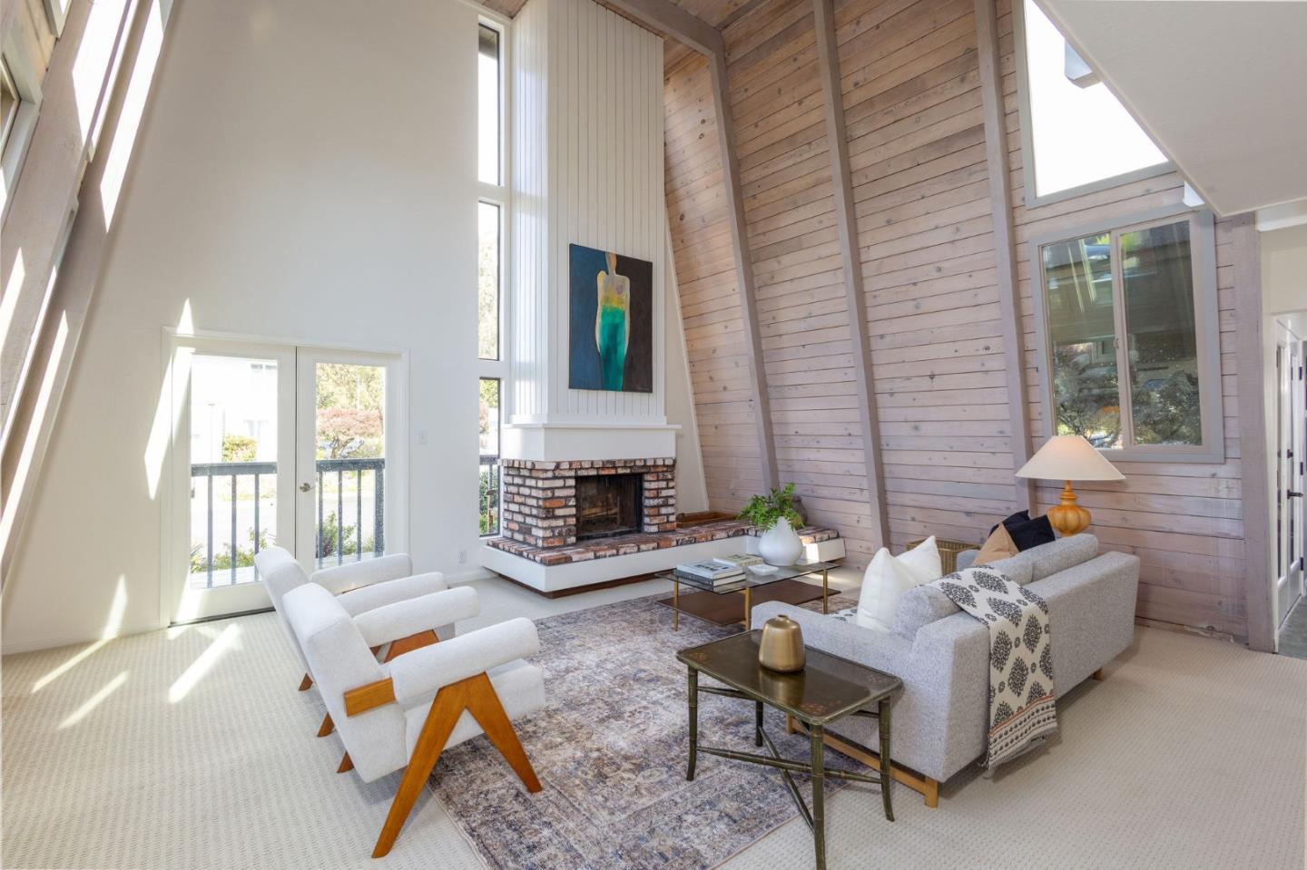 314 Roosevelt Boulevard Half Moon Bay, CA 94019 - Photo 12 of 58 a living room with furniture and a fireplace