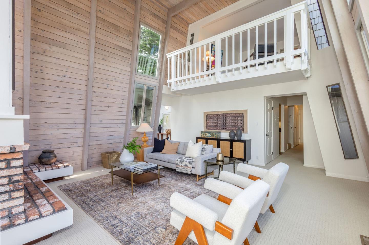 314 Roosevelt Boulevard Half Moon Bay, CA 94019 - Photo 13 of 58 a living room with furniture and a rug