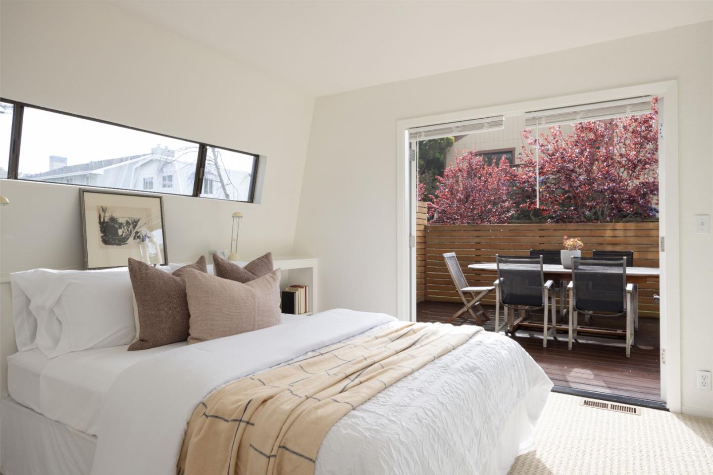 314 Roosevelt Boulevard Half Moon Bay, CA 94019 - Photo 26 of 58 a bedroom with a bed a large window with chair and table