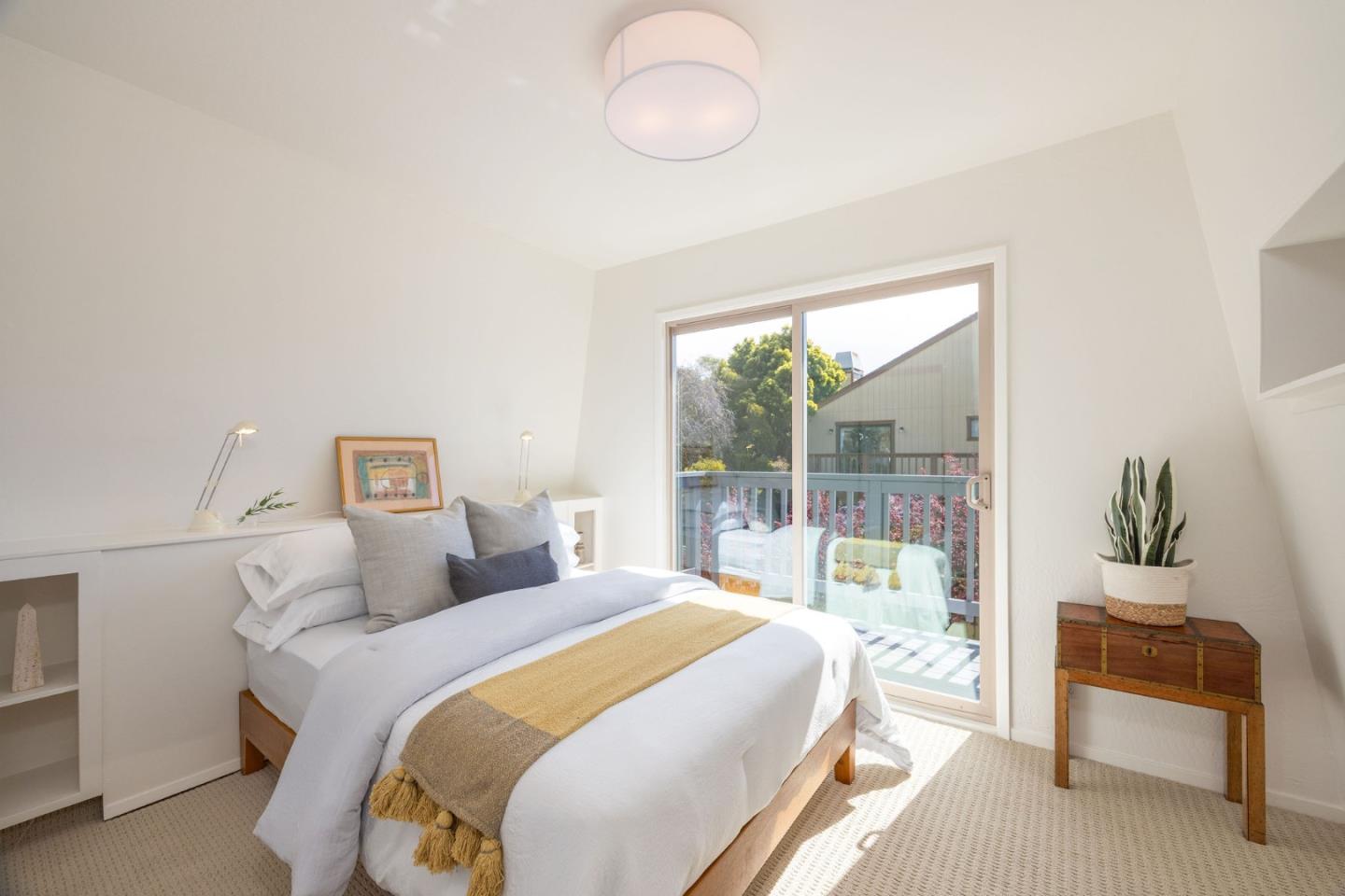 314 Roosevelt Boulevard Half Moon Bay, CA 94019 - Photo 45 of 58 a bedroom with a bed and a couch