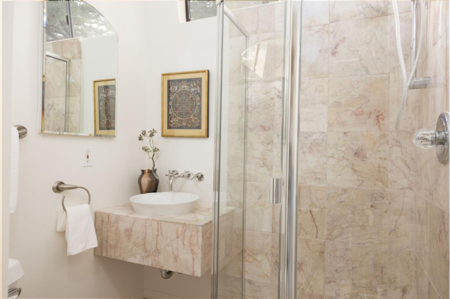 314 Roosevelt Boulevard Half Moon Bay, CA 94019 - Photo 46 of 58 a bathroom with a sink and a mirror