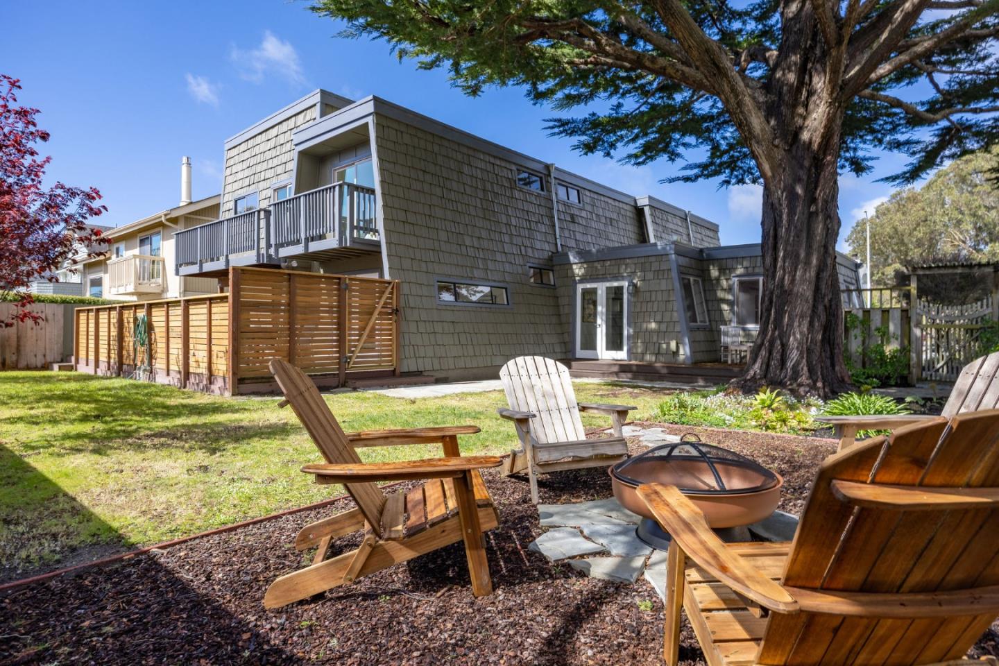 314 Roosevelt Boulevard Half Moon Bay, CA 94019 - Photo 48 of 58 a view of backyard of house with seating area