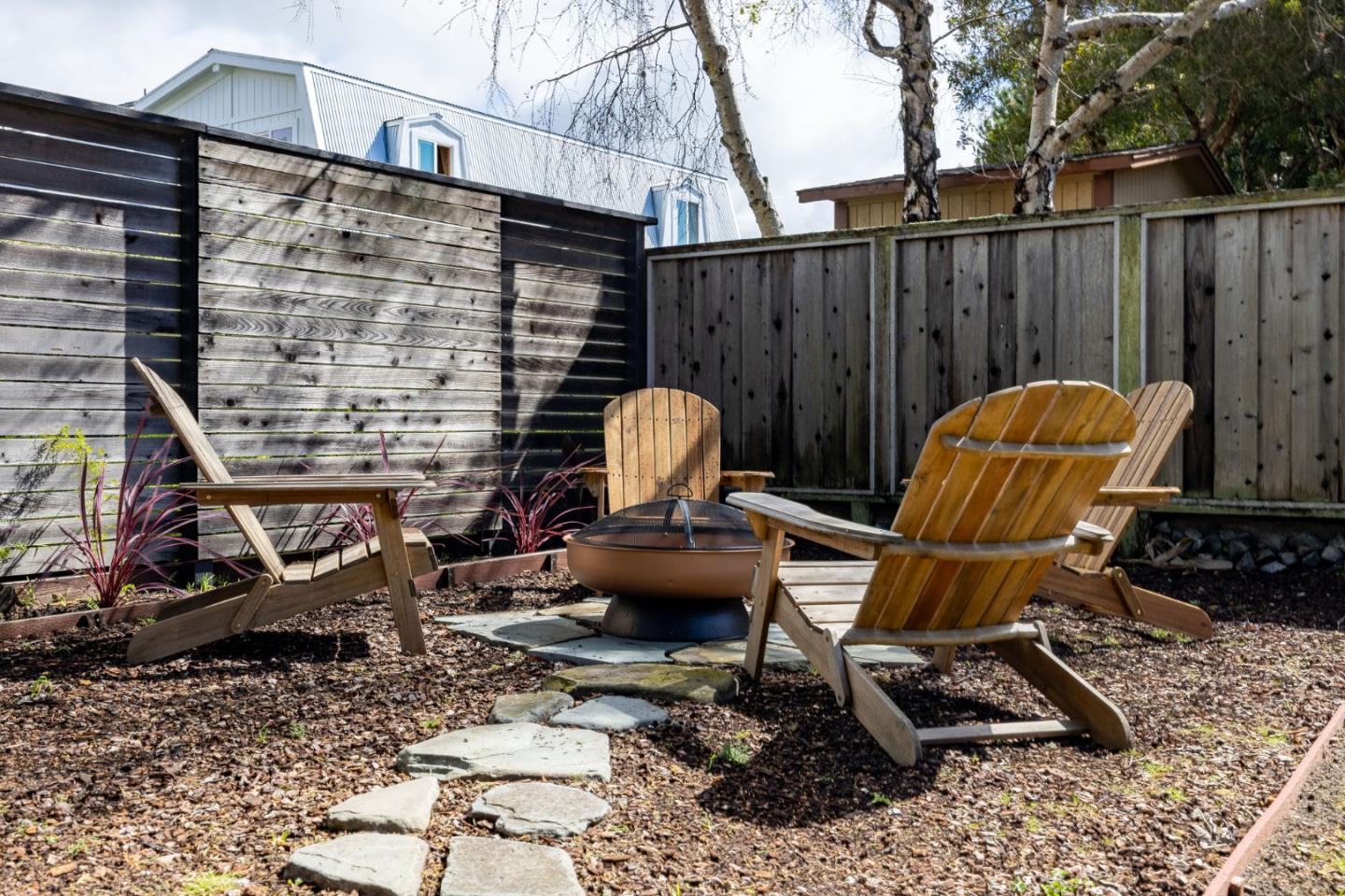 314 Roosevelt Boulevard Half Moon Bay, CA 94019 - Photo 49 of 58 a view of a chairs and table in backyard