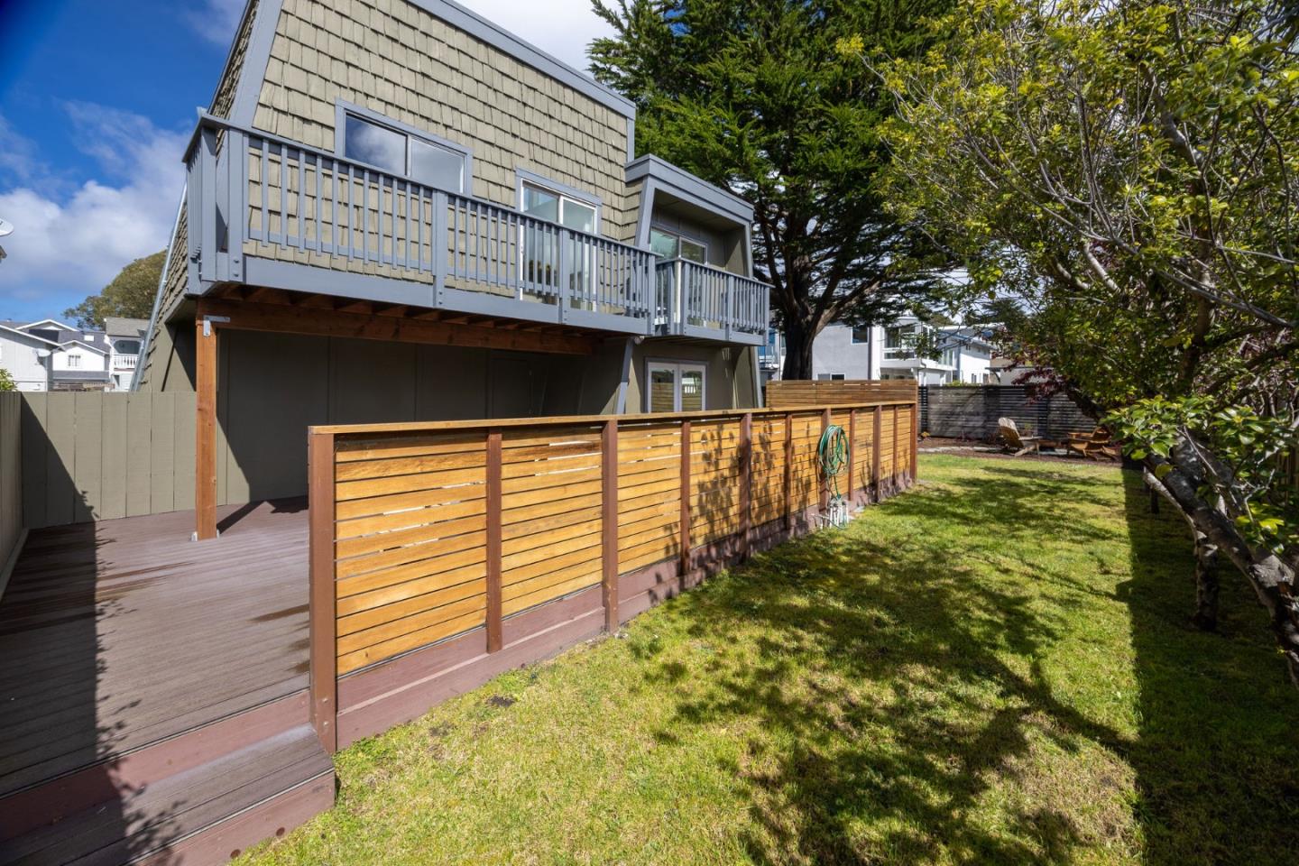 314 Roosevelt Boulevard Half Moon Bay, CA 94019 - Photo 50 of 58 a front view of a house with a yard