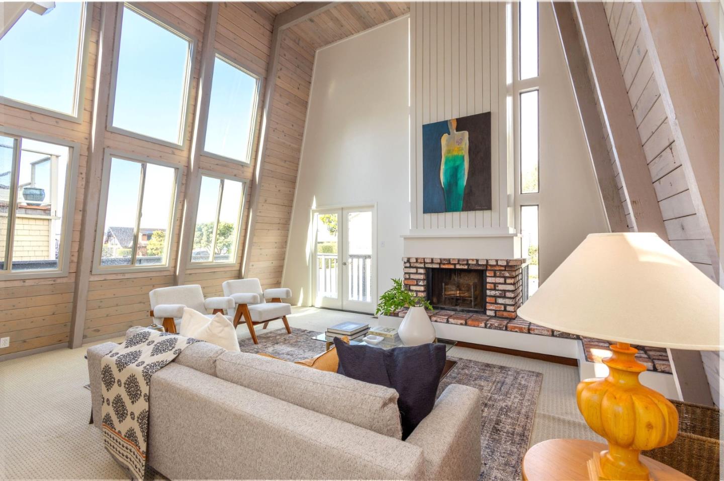 314 Roosevelt Boulevard Half Moon Bay, CA 94019 - Photo 9 of 58 a living room with furniture and a fireplace