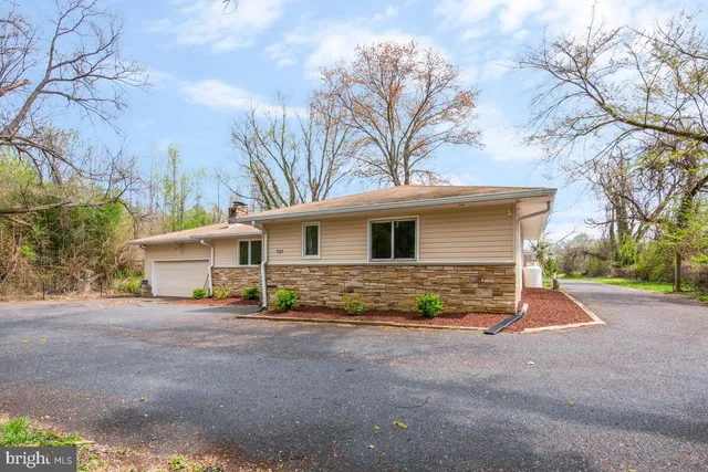 a view of a house with a street