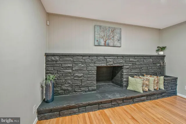 a view of fireplace and wooden floor