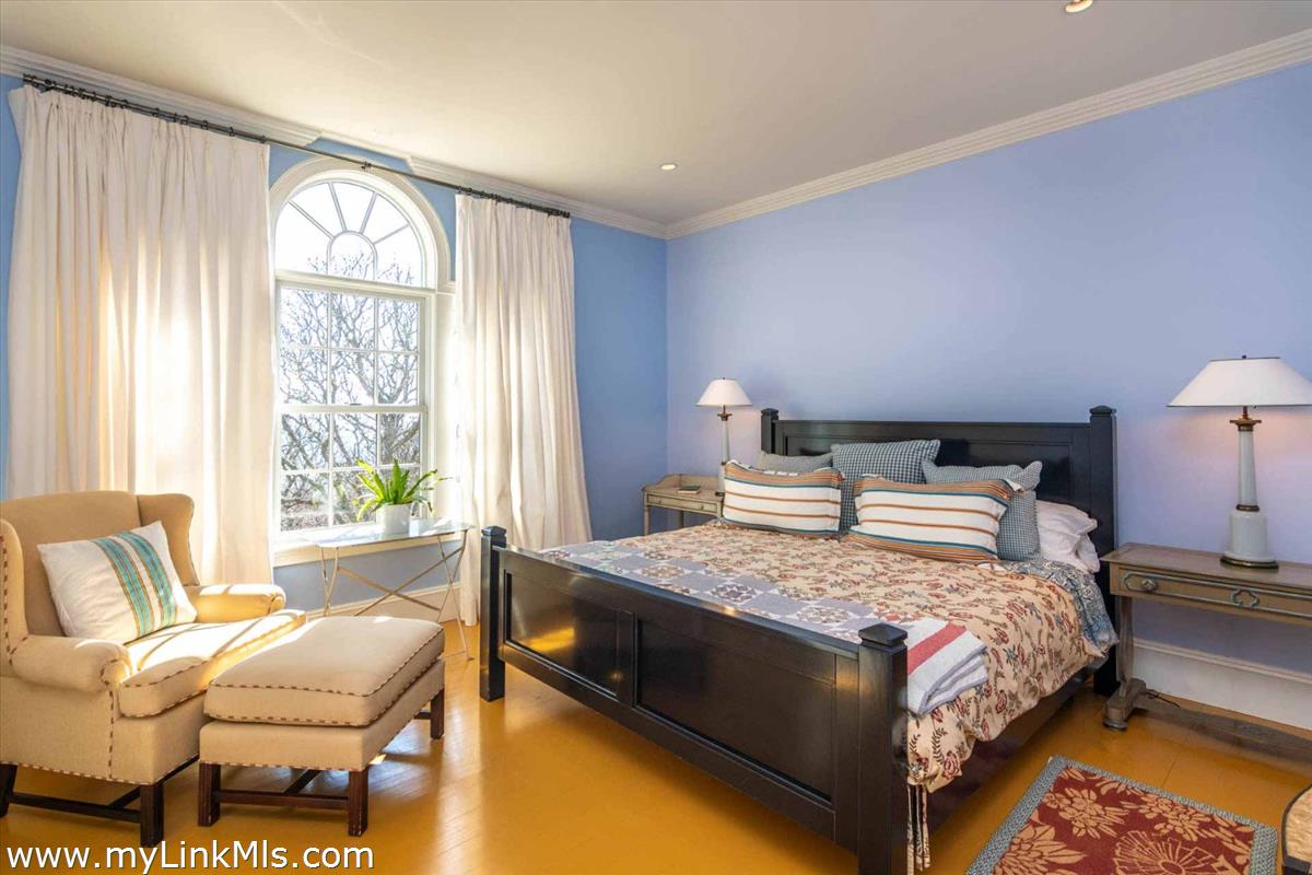 25 Lelands Path Edgartown, MA 02539 - Photo 50 of 56 a bedroom with a bed and a couch