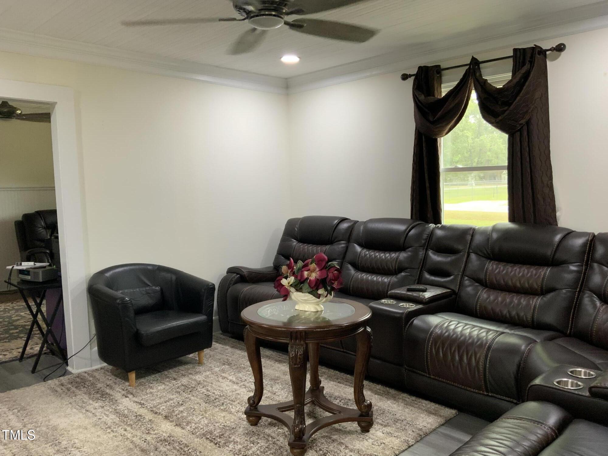 121 Storey Road Murfreesboro, NC 27855 - Photo 14 of 31 a living room with furniture a air conditioner and a window