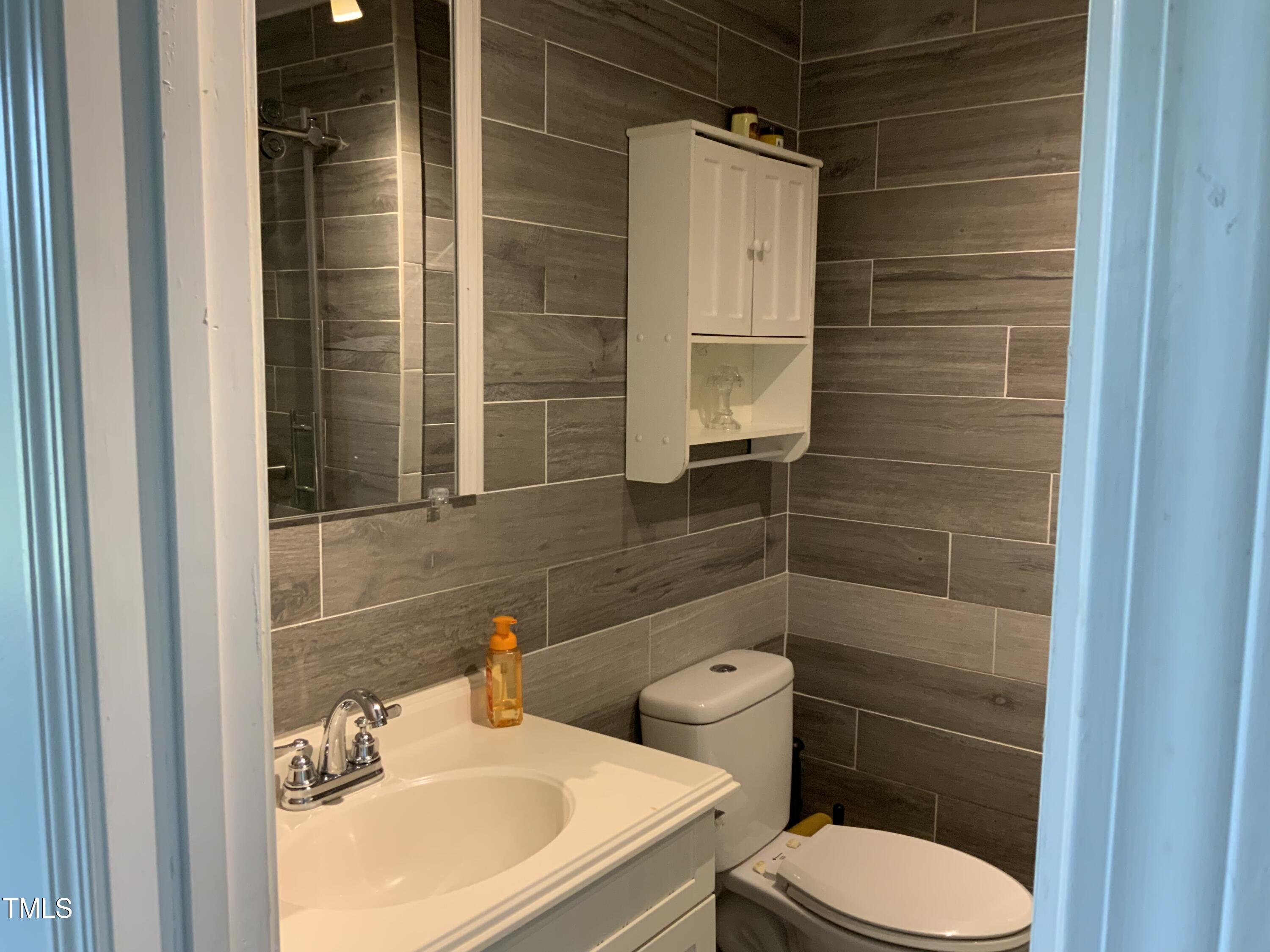 121 Storey Road Murfreesboro, NC 27855 - Photo 20 of 31 a bathroom with a sink toilet and shower