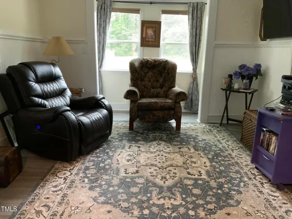 a bedroom with a bed and a television