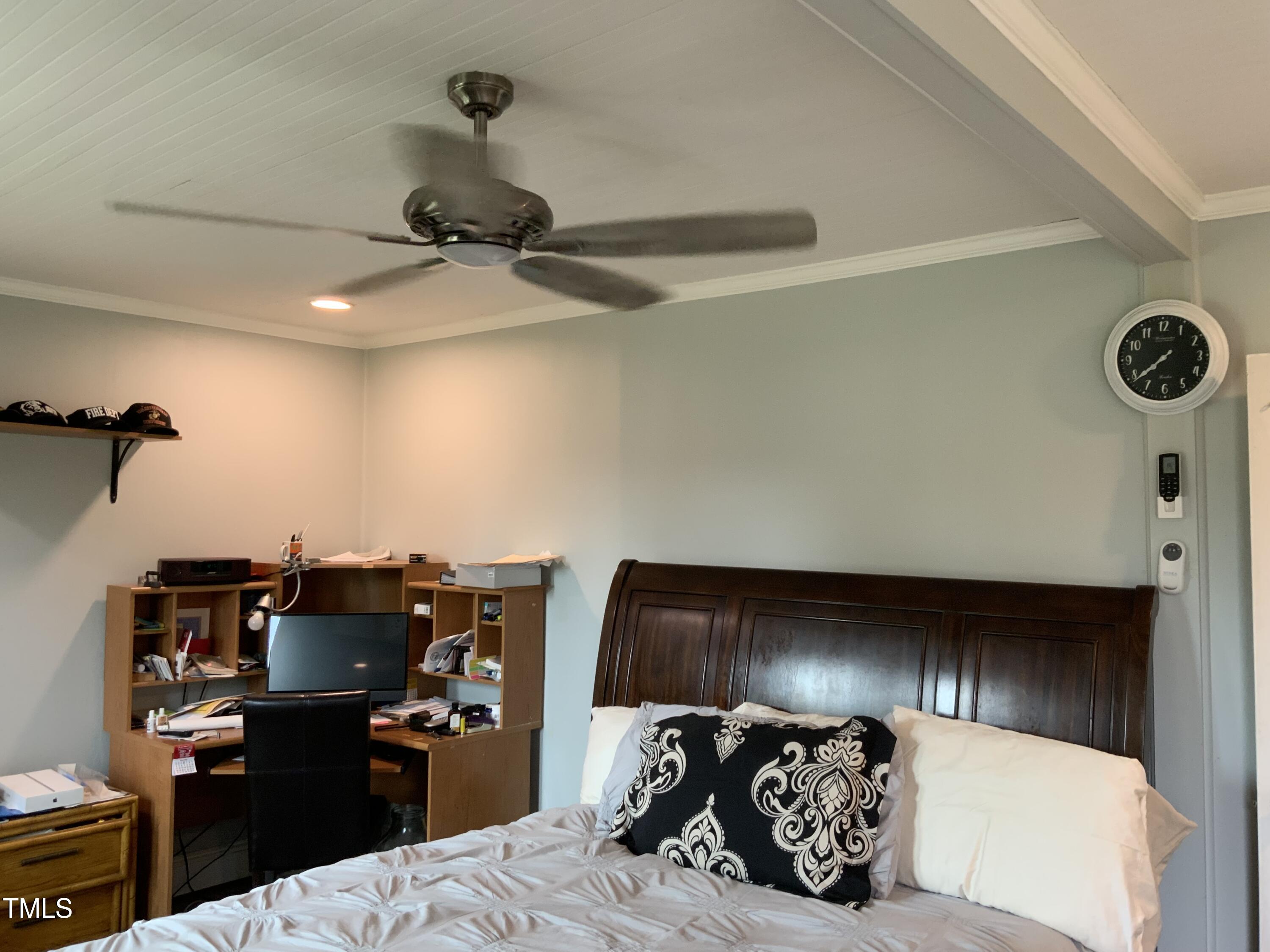 121 Storey Road Murfreesboro, NC 27855 - Photo 24 of 31 a bedroom with a bed and ceiling fan