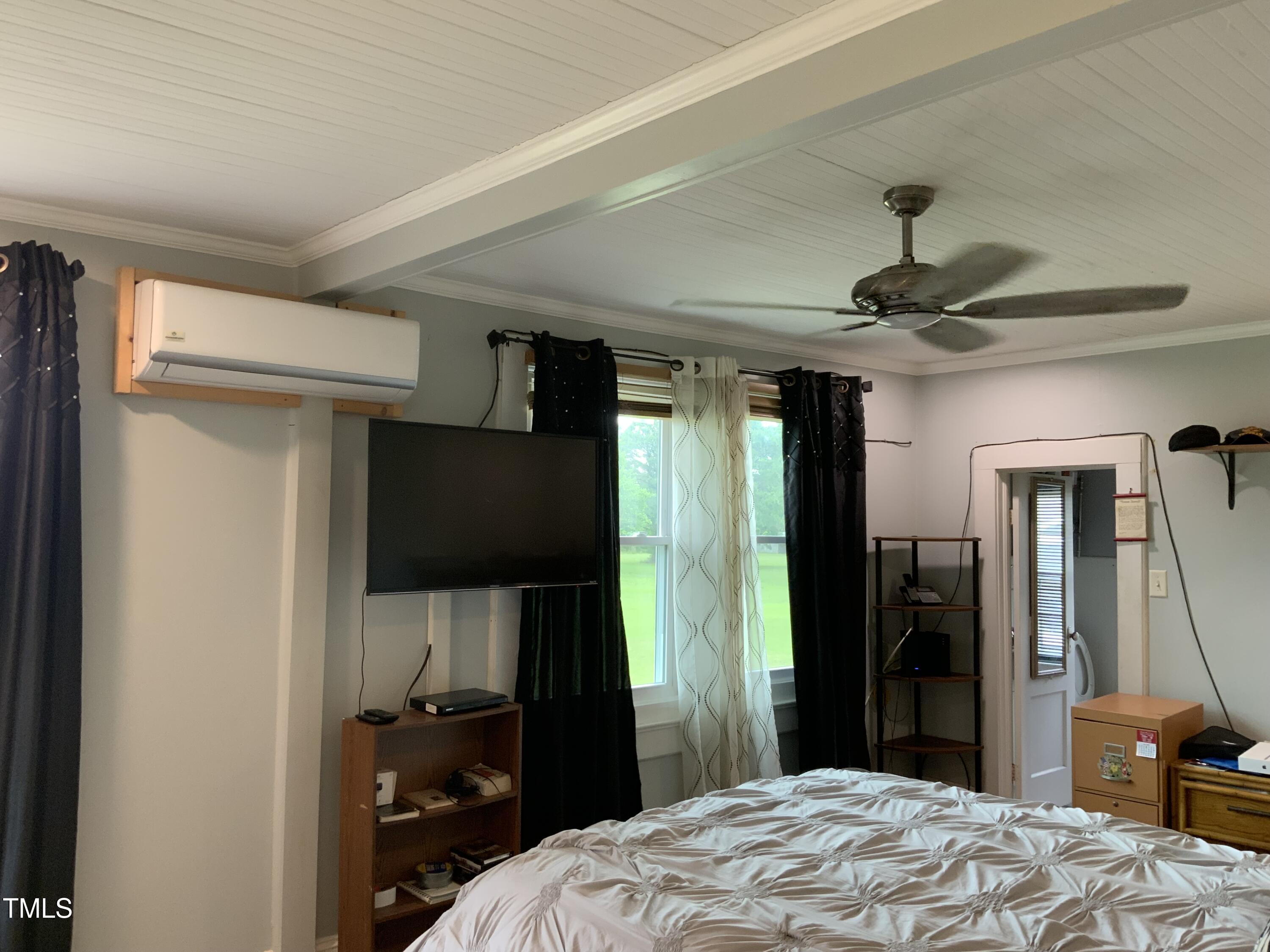 121 Storey Road Murfreesboro, NC 27855 - Photo 25 of 31 a bedroom with a bed and a television