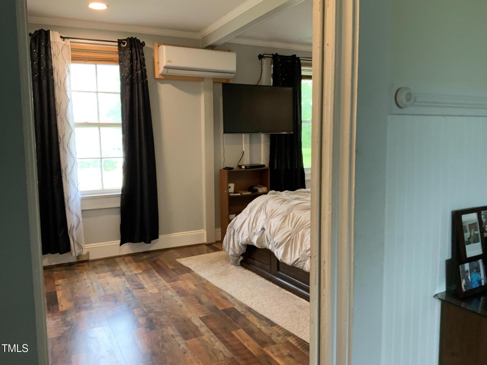121 Storey Road Murfreesboro, NC 27855 - Photo 26 of 31 a view of bedroom with wooden floor and window