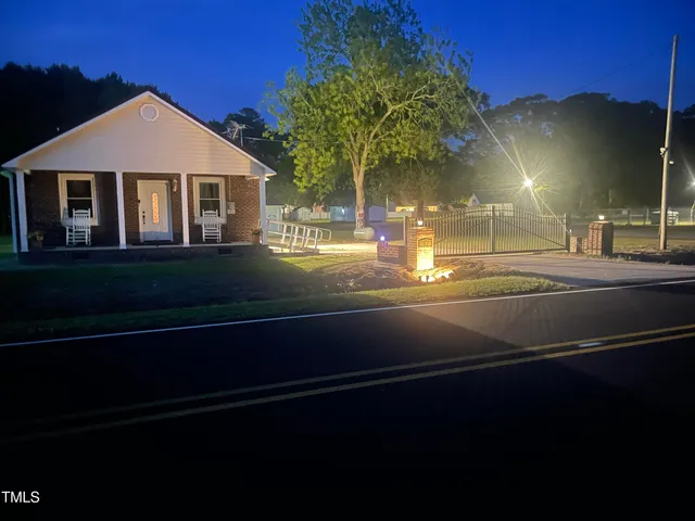 a front view of a house with yard