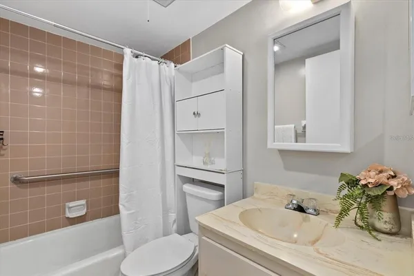 a bathroom with double sink and a mirror