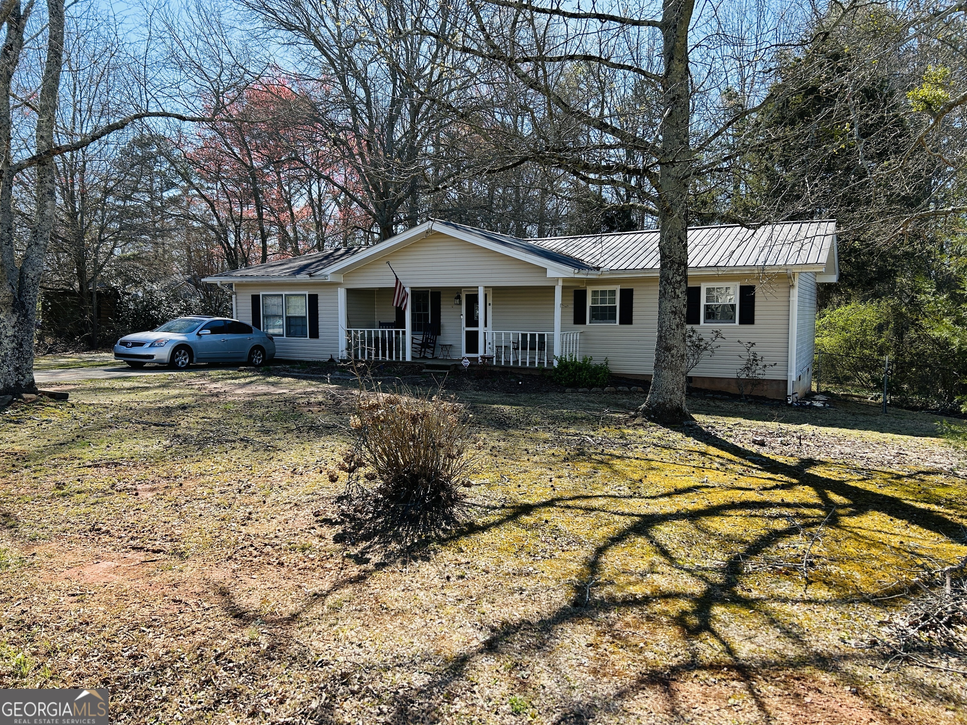2164 Pea Ridge Road Cornelia, GA 30531 - Photo 1 of 1 a front view of a house with a yard
