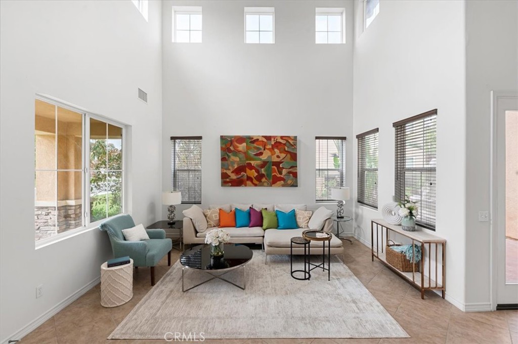 9538 Kings Court Riverside, CA 92508 - Photo 1 of 1 a living room with furniture and a large window