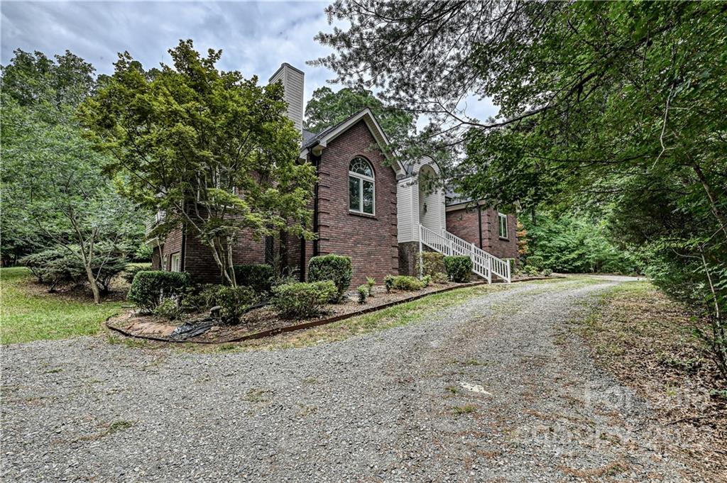 6430 Waters Edge Drive Midland, NC 28107 - Photo 2 of 48 a front view of a house with a yard