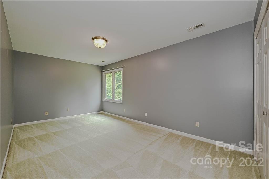 6430 Waters Edge Drive Midland, NC 28107 - Photo 29 of 48 an empty room with windows and mirror