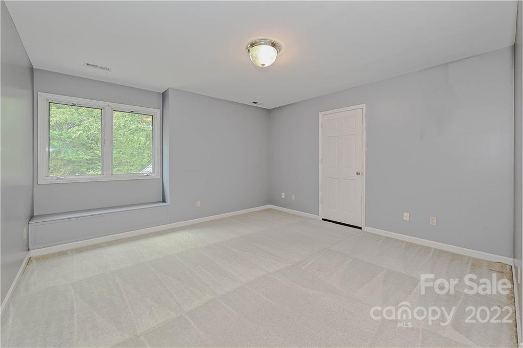 6430 Waters Edge Drive Midland, NC 28107 - Photo 32 of 48 a view of an empty room with a window