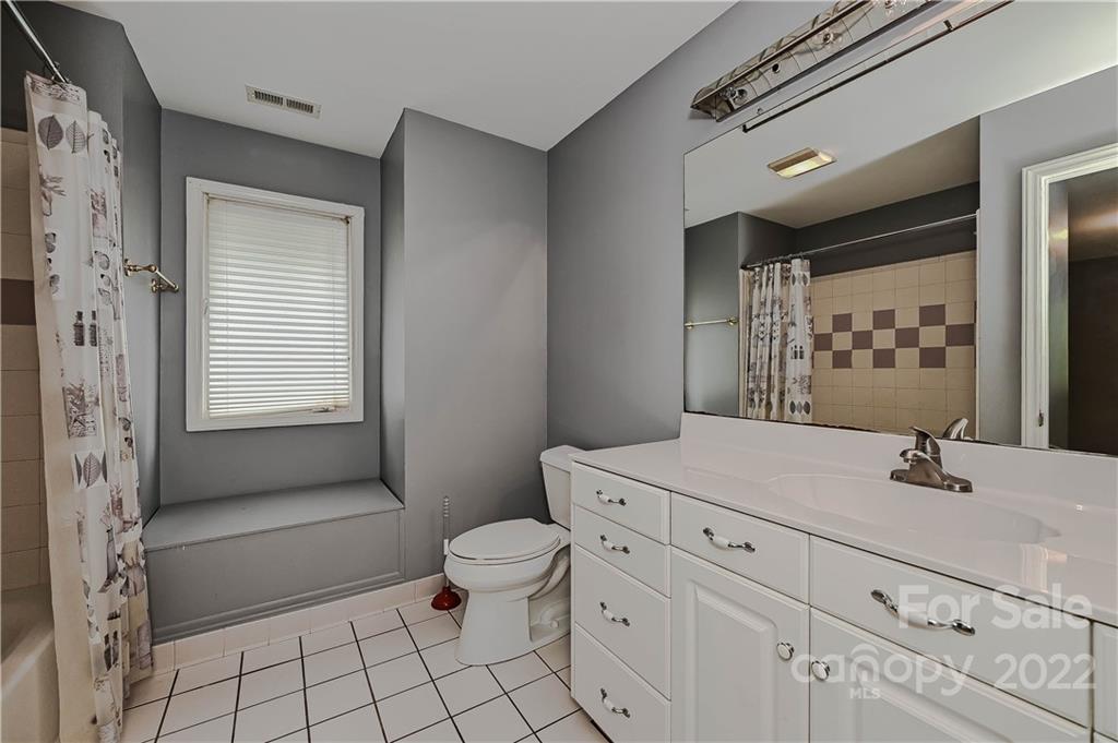 6430 Waters Edge Drive Midland, NC 28107 - Photo 34 of 48 a bathroom with a sink toilet and shower