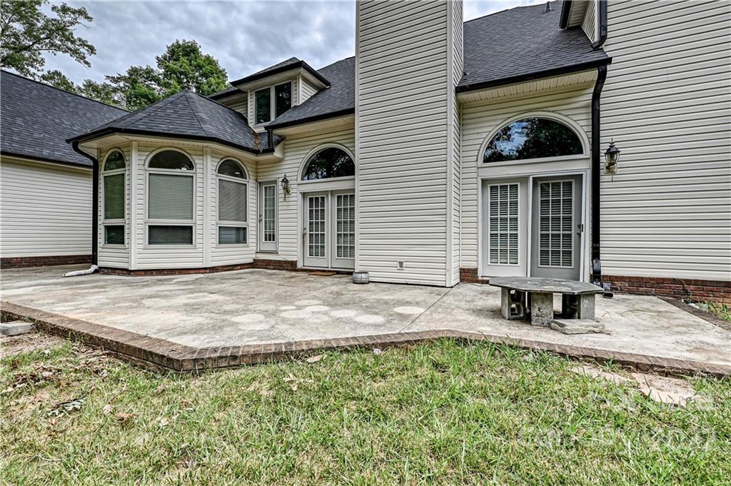 6430 Waters Edge Drive Midland, NC 28107 - Photo 40 of 48 a front view of a house with garden