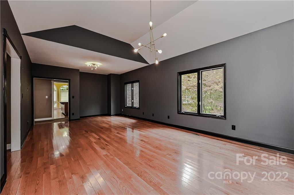 6430 Waters Edge Drive Midland, NC 28107 - Photo 8 of 48 an empty room with wooden floor and windows