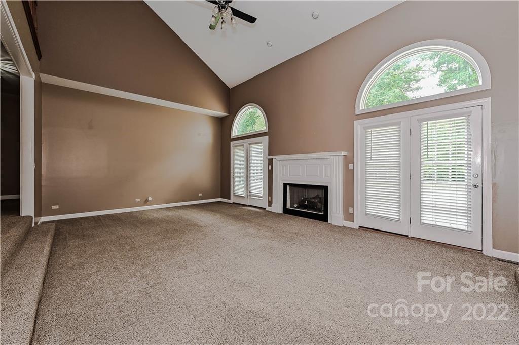 6430 Waters Edge Drive Midland, NC 28107 - Photo 10 of 48 an empty room with a fireplace