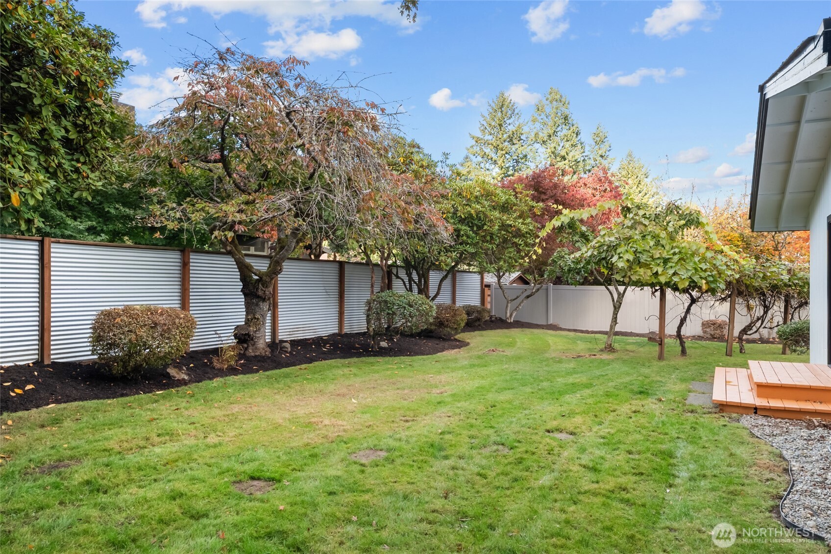1414 Hummingbird Lane Northwest Olympia, WA 98502 - Photo 12 of 40 a backyard of a house with lots of green space