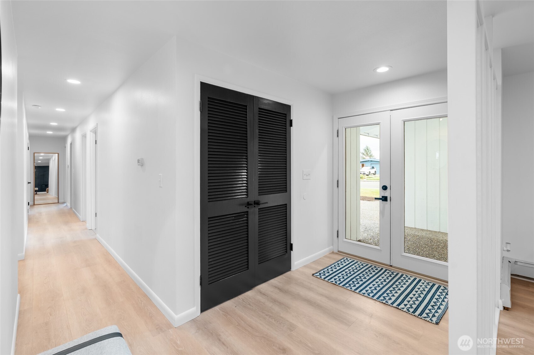 1414 Hummingbird Lane Northwest Olympia, WA 98502 - Photo 14 of 40 a view of a bedroom from a hallway