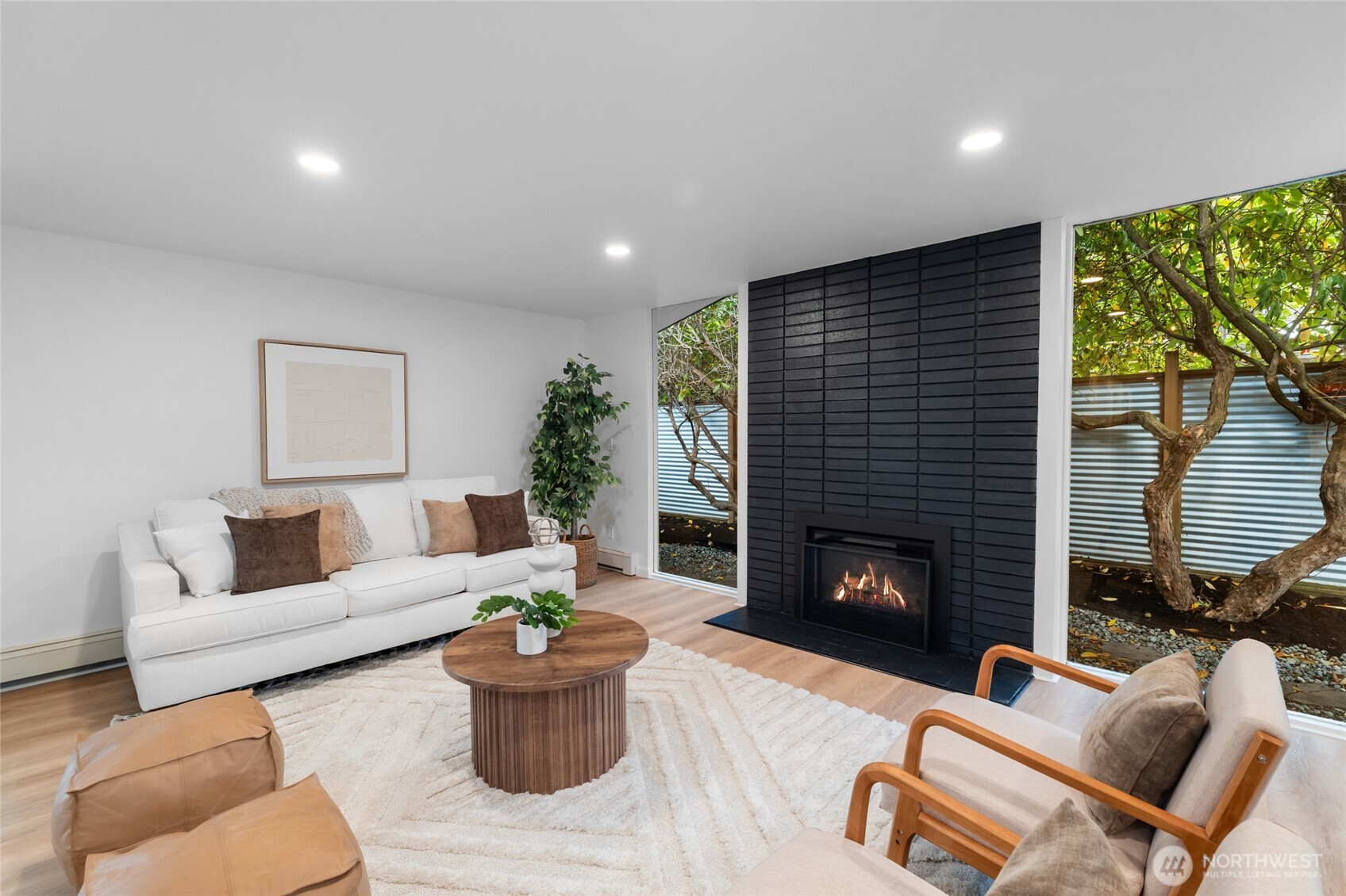 1414 Hummingbird Lane Northwest Olympia, WA 98502 - Photo 15 of 40 a living room with furniture and a fireplace