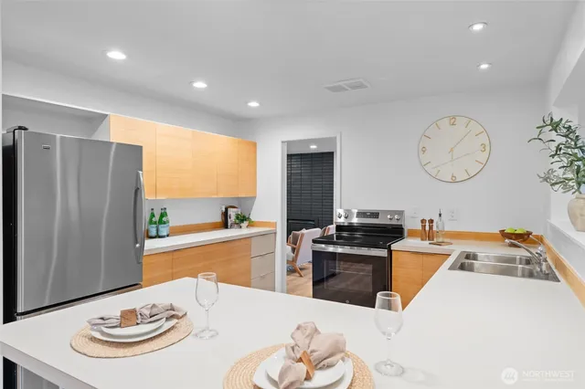 a kitchen with a appliances and cabinets