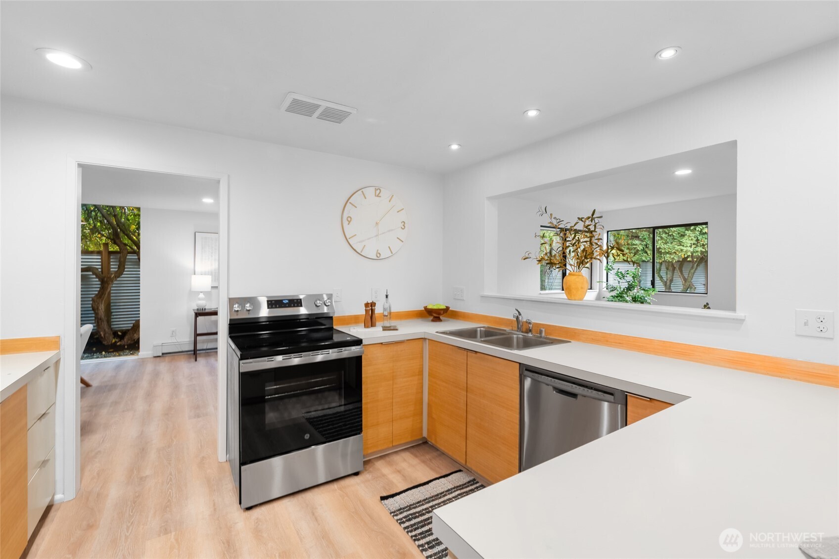 1414 Hummingbird Lane Northwest Olympia, WA 98502 - Photo 21 of 40 a kitchen with stainless steel appliances granite countertop a stove and a sink