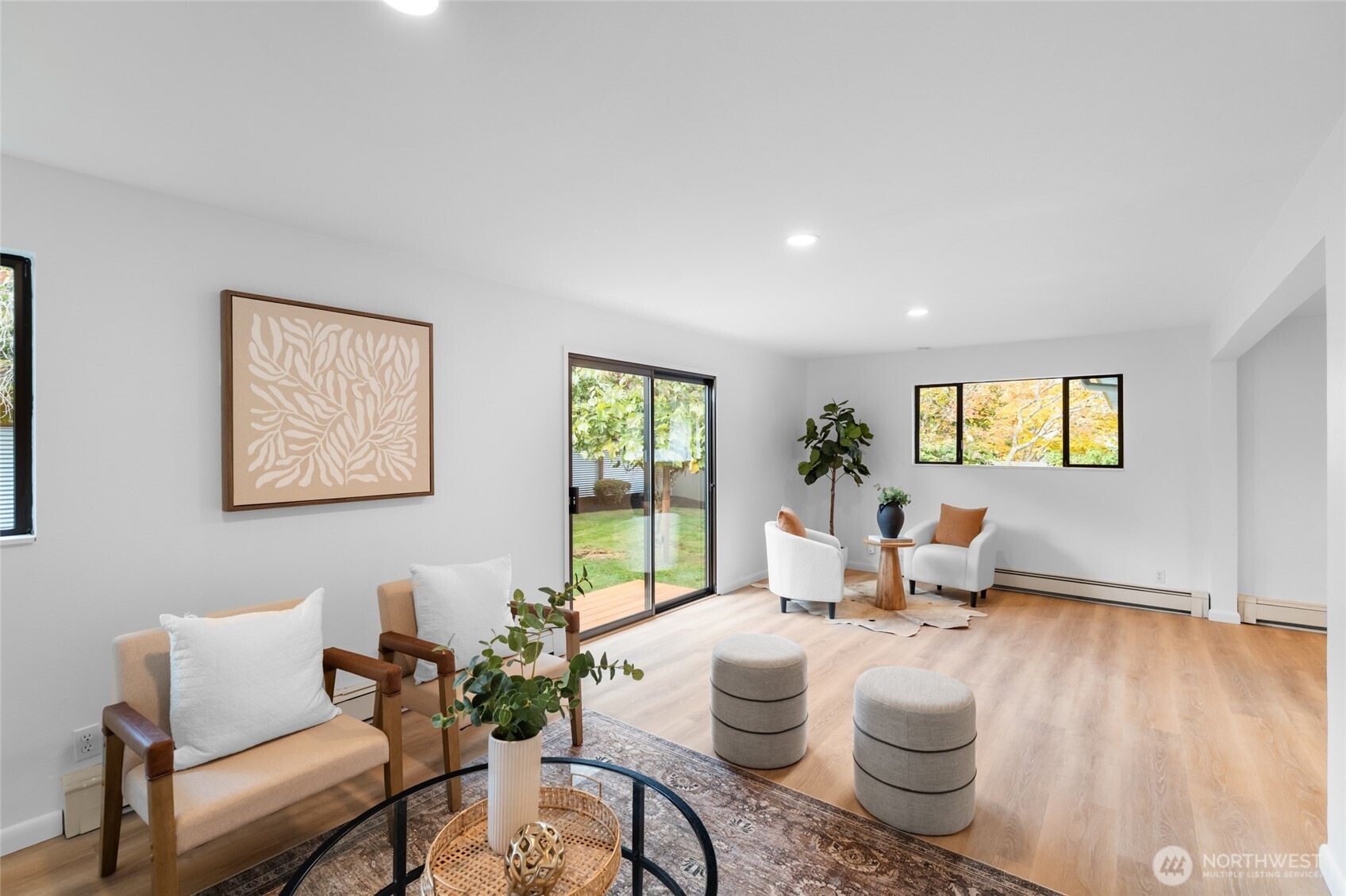 1414 Hummingbird Lane Northwest Olympia, WA 98502 - Photo 24 of 40 a living room with furniture and a wooden floor